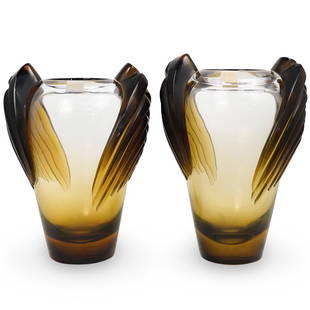 (2) Lalique Art Deco Marrakech Vases: DESCRIPTION: Two Lalique Art Deco amber and clear frosted vases, in the "Marrakech" pattern, decorated on each side with Art Deco designs. Stickered and Engraved "Lalque France". (One slightly larger