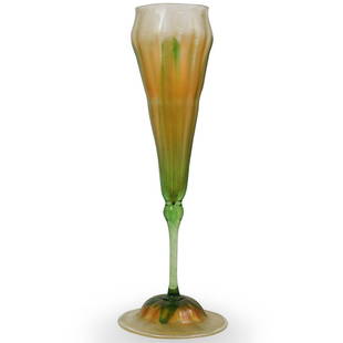 Tiffany Favrile Glassware: DESCRIPTION: A L.C.T. Tiffany Glass Floriform Vase. A hand blown art glass floriform with ruffled pulled feather body. Marked ''L.C.T. 4813"CIRCA: 20th CenturyORIGIN: New YorkDIMENSIONS: H.