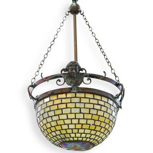 Tiffany Studios "Turtle Back" Hanging Lamp: DESCRIPTION: A Tiffany studios Hanging lamp, composed of a metal center rod sustaining a glass lamp shade by three chains. The lamp shade is decorated with geometric patterns, and finished by an