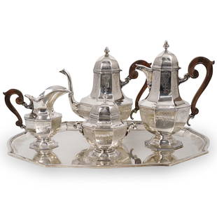 (5 Pc) Mario Buccellati Sterling Silver Tea Service: DESCRIPTION: A 5-Piece Sterling Silver Tea set by Mario Buccellati, featuring engraved foliate design with wooden handles. Stamped on the underside "Mario Buccellati Italy Sterling 925" Total weight: