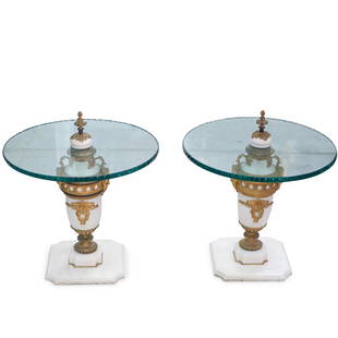 Pair Of Marble, Bronze Urn Tables: DESCRIPTION: A Pair of marble and gilt bronze urn converted to an occasional table with heavy scalloped rim circular glass panel top.CIRCA: Early-Mid 20th CenturyORIGIN: FranceDIMENSIONS: H. 25.5" x