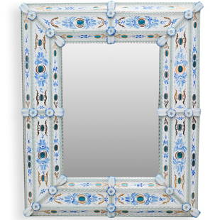 Murano Floral Porcelain Mirror: DESCRIPTION: A Venetian Murano glass and floral painted porcelain mirror, with applied clear and blue glass floral accents decorating the frame.CIRCA: 20th CenturyORIGIN: ItalyDIMENSIONS: H. 43.5" x