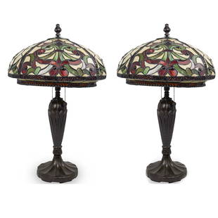 Pair of Dale Tiffany Style Table Lamps: DESCRIPTION: Of patinated metal base, with Tiffany style leaded glass lamp shade, and brass trademark plate. CIRCA: 20th Century ORIGIN: Continental DIMENSIONS: H. 27" x D. 15" CONDITION: Great condit