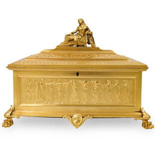 Neoclassical Gilt Bronze Casket Box: DESCRIPTION: A Neoclassical French gilt-bronze footed casket box with hinged lid, depicting a high relief classical figures on the exterior, the interior is fitted with dark green velvet covering,