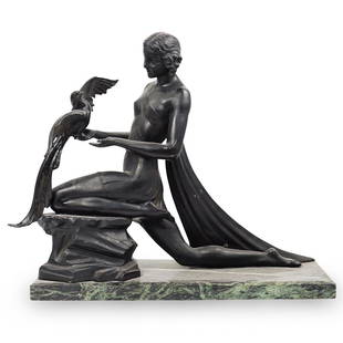 Jacques Limousin Classical Bronze Sculpture: DESCRIPTION: An Art Deco bronze sculpture after Jacques Limousin, depicting a classical female subject holding a bird in one hand, signed on the edge of dress "Limousin". The sculpture rests on a gree