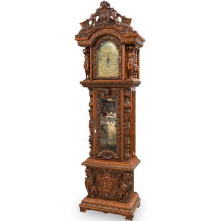 Hermle Carved Tall-Case Grandfather Clock: DESCRIPTION: A late 19th century Hermle Renaissance Revival hand-carved oakwood tall-case clock with wood carving of figures, griffins, lions, and sweeping raised floral motifsCIRCA: 19th / 20th