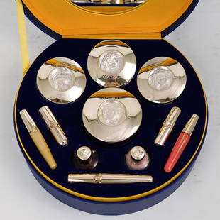 (11 Pc) Versace Presentation Make Up Case: DESCRIPTION: A 11 piece versace make up kit features four vanity and powder boxes, two nail polishes, four lip sticks and an eye liner. Decoraed with Versace Medusa Head. Comes in original presentatio