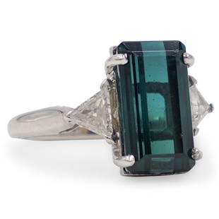 Cartier 18k, Tourmaline and Diamond Ring: DESCRIPTION: A 18k White gold ring setting, centered by a green tourmaline (Original diamond was replaced by current Tourmaline) The Center is flanked by two triangle cut diamonds amounting to a