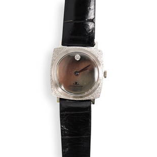 Vintage Jaeger Lecoultre 14k White Gold Watch: DESCRIPTION: A Vintage Jaeger Lecoultre watch, composed of a 14k white gold encasing embellished along the 12 o clock marker by a single cut diamond, stamped along the back "14k Gold". Total Weight: