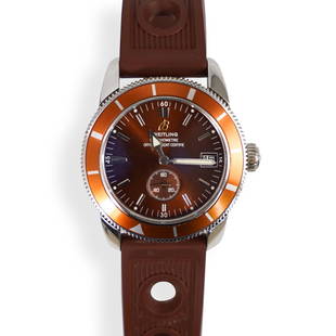 Breitling Superocean Heritage 38 Mens Watch: DESCRIPTION: A Breitling Superocean Heritage 38 Mens Watch, features in stainless steel with a bronze dial and orange bezel. Has an automatic movement, crystal sapphire, attached to a silicone