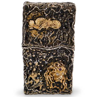 Sterling Silver, Gold and Diamond Cigarette Case: DESCRIPTION: A Judaica sterling silver, gold and diamond cigarette case, depicts a brutalist style case with continuous open work design, features two raised gold lion figurines, one with diamonds