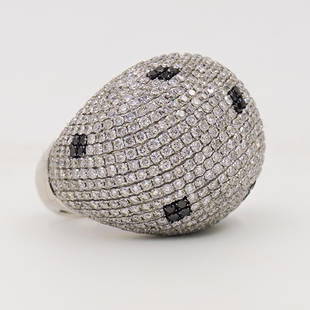 Large 18k Gold and Pave Diamond Ring: DESCRIPTION: A Large 18k white gold ring, decorated with pave diamonds in a white and black design. The diamonds amount to approx. a total of 13.5 cts, marked "18k" Total Weight of Ring: 30.6 Grams