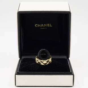 Chanel Matelasse 18k Gold Band: DESCRIPTION: A Chanel Matelasse Band composed of 18 yellow gold, featuring a mechanical woven design. Marked along the side "Chanel" and "750 20H 2416 T52". Total Weight: 12.8 Grams (8.2 dwt) Comes