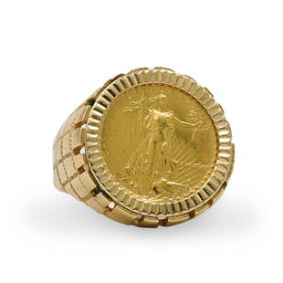 14k Liberty Gold Coin Ring: DESCRIPTION: A 14k yellow gold ring centered by a gold Liberty Coin, further embellished along the sides with a gridded design. Marked along the underside "14k". Total Weight: 11.2 Grams (7.3