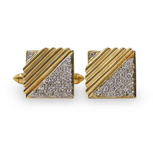 Pair Of 14k Gold and Diamond Cufflinks: DESCRIPTION: A pair of cufflinks composed of 14k yellow gold, the face of the cufflinks are decorated with parallel incision lines flanked by pointer diamond settings amounting to .5cts each, marked