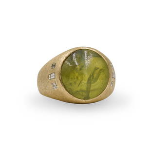 14k Gold, Cats Eye and Diamond Ring: DESCRIPTION: a 14k yellow gold ring, centered by a Chrysoberyl Cats Eye cabochone, further embellished on either side by baguette cut diamonds. Marked "14k" Total Weight: 12.3 dwtCIRCA: 20th