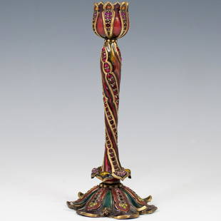 Jay Strongwater Candlestick: DESCRIPTION: Jay Strongwater bronze and enamel candlestick with synthetic stones marked traditionally on the bottom.CIRCA: 20th centuryORIGIN: U.S,ADIMENSIONS: 7'' tall and 3'' wide at the bassÃ‚
