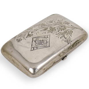 Russian Silver Card Box: DESCRIPTION: A Russian Silver card case hinged box with engraved foliate decoration and monogram inscription. Hallmarked on the interior "Cha3abi C.H. 84". Weight: 105.4 grams. Tested 87% CIRCA: 20th