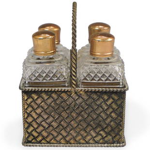 Antique English Sterling Silver Cruet: DESCRIPTION: An antique English Sterling Silver cruet set, featuring a sterling basket with central handle and woven motifs, holding four cut-crystal faceted bottles with gold tone top. Hallmarked on