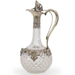 A. Fickert Silver and Cut Crystal Decanter: DESCRIPTION: Silver and cut crystal decanter / pitcher featuring diamond cut design on lower body, with clusters of grapevines around the collar and grape motif on finial. Stamped on the handle "Fiche