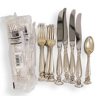 (23 Pc) Wallace Sterling Silver Flatware: DESCRIPTION: A 23 piece set of Wallace Sterling silver flatware in the "Romance of the Sea" pattern. Features shell design. Hallmarked. Weight: 1124 grams (minus stainless steel blades).Comprising