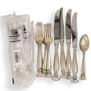 (23 Pc) Wallace Sterling Silver Flatware: DESCRIPTION: A 23 piece set of Wallace Sterling silver flatware in the "Romance of the Sea" pattern. Features shell design. Hallmarked. Weight: 1124 grams (minus stainless steel blades). Comprising of