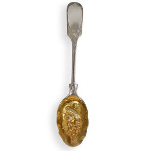 Joseph Rodgers & Sons Spoon: DESCRIPTION: A sterling silver and gold spoon by Joseph Rodgers & Sons, depicting various fruit motifs engraved onto the bowl. makers mark dates to 1913. Hallmarked on handle. Weight: 28 grams.CIRCA: