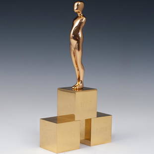 Ernest Trova (American, 1927-2009) "Everything Follows": DESCRIPTION: A sculpture by American surrealist Ernest Trova titled "Everything follows everything" composed of a polished bronze in gilded tones. Engraved with Trova mark, Numbered "19/99" and dated