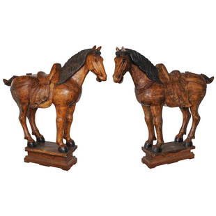 Life Sized Oriental Carved Wood Horse Sculptures: DESCRIPTION: A pair of 19th century life-sized carved wood horse sculptures. Depicts decorative horses with intricately carved saddle, mane, and features. Each standing on a rectangular base atop a