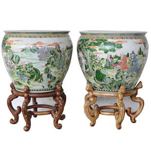 Chinese Porcelain Fishbowl Planters: DESCRIPTION: A Pair of Chinese porcelain fish bowl planter with bases. Enameled with figures in landscape on exterior, the interior with iron red goldfish amid seaweed. The planters are sitting atop a