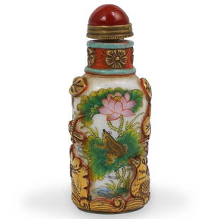 Signed Chinese Peking Glass Snuff Bottle: DESCRIPTION: A Chinese peking glass snuff bottle features painted scenes depicting frogs in a pond setting, overlaid with raised floral decorations decorated in a gilt hue, completed a the top with