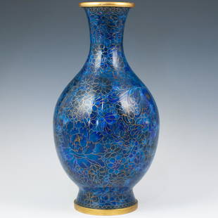 Vintage Chinese Cloisonne Vase: DESCRIPTION: A cloisonne vase in an overall royal blue enamel base, further embellished by wired outlines portraying blossoming lotus flowers. Vase was previously converted into lamp and has small dri