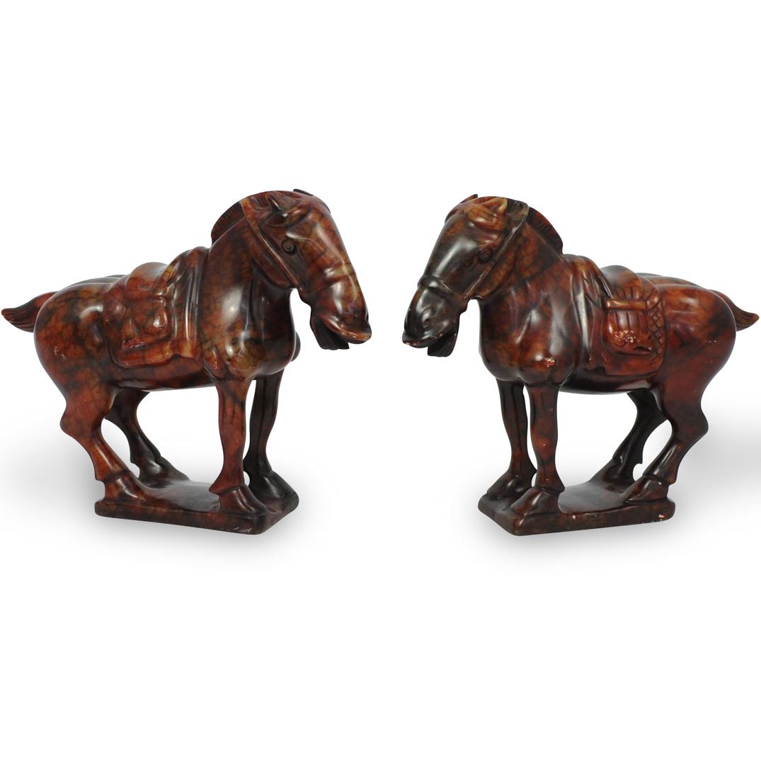 Pair Of Chinese Hard Stone Horses: DESCRIPTION: A pair of oriental hard stone horses depict two mirroring statues in red to orange hues standing on square platforms.Ã‚ CIRCA: 20th Cent.Ã‚ ORIGIN: Possibly China DIMENSIONS: H: 8 1