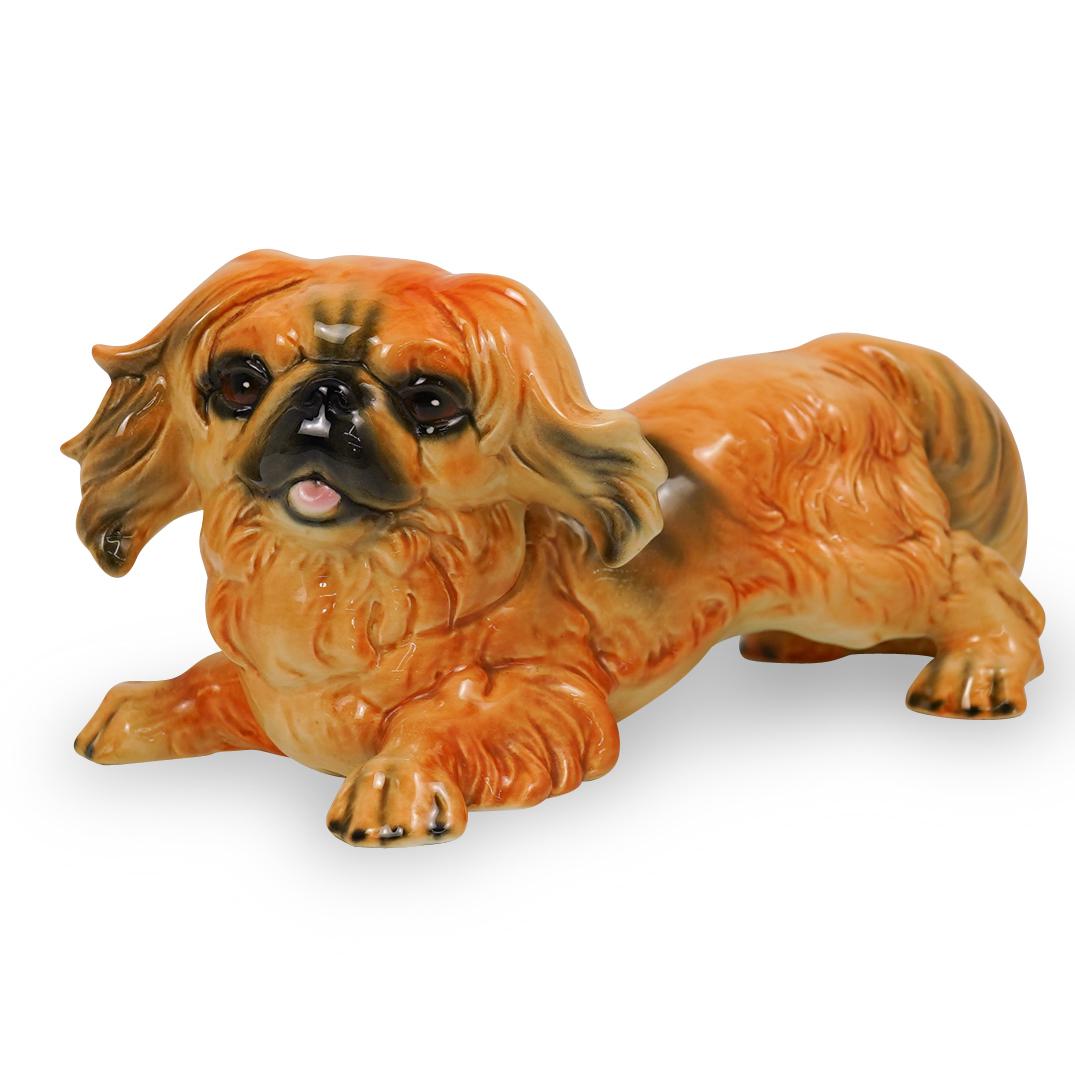 Goebel Porcelain Spaniel Figurine: DESCRIPTION: A Goebel hand painted porcelain Spaniel. Labeled on the underside. CIRCA: 20th Century ORIGIN: Germany DIMENSIONS: H. 5.5" x W. 11" CONDITION: Great condition. See lot description for det