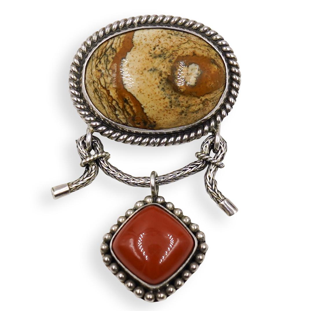 Indonesian Jasper Stone Pendant: DESCRIPTION: An Indonesian jasper and carnelian stone pendant on sterling silver frame. Marked "925 BA Indonesia" Weight: 32 grams. CIRCA: 20th Century ORIGIN: Southeast Asia DIMENSIONS: L. 2.25" COND