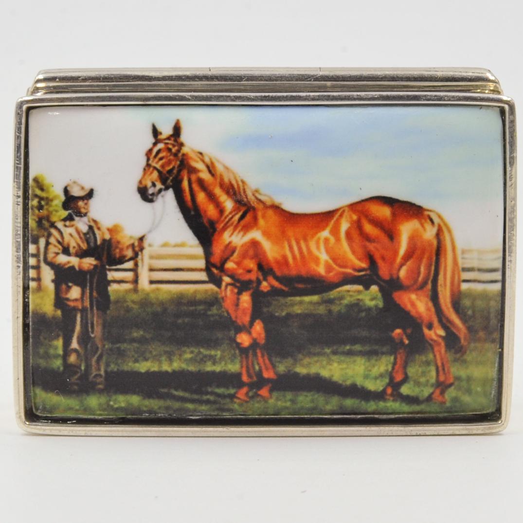 Sterling Silver and Enamel Pill Box: DESCRIPTION: A Sterling silver and enamel pill box. Features a horse standing next to gentleman. Marked "Sterling". Weight: 38.7 grams. CIRCA: 20th Century ORIGIN: Continental DIMENSIONS: L. 1. 7/8" C