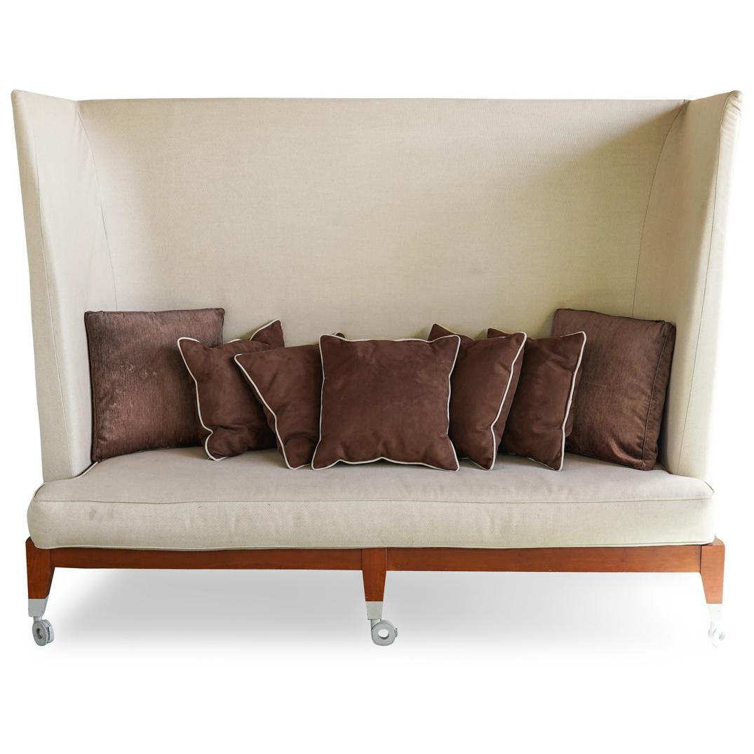 Phillip Starck "Neoz" Sofa: DESCRIPTION: Of wooden structure and ebonized finish. Aluminum casting leg terminals with nylon castors. polyurethane foams padded with linen/cotton hem-stitched detachable upholstery. CIRCA: 21st Cen