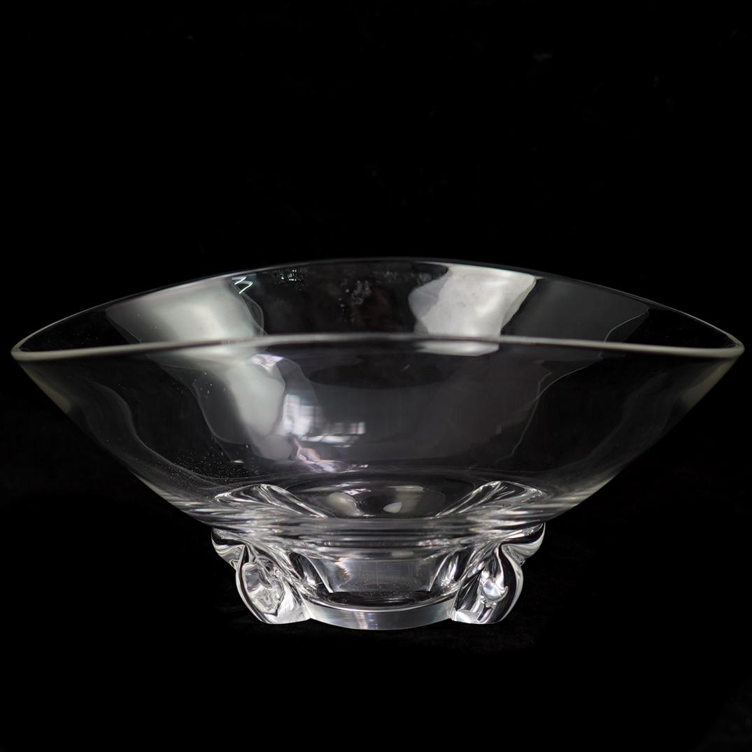 Steuben Crystal Bowl: DESCRIPTION: Steuben crystal bowl features a deep and shallow crystal bowl supported by scroll feet. Signed on the underside. CIRCA: 20th Century ORIGIN: USA DIMENSIONS: H. 5" x D. 11" CONDITION: Grea