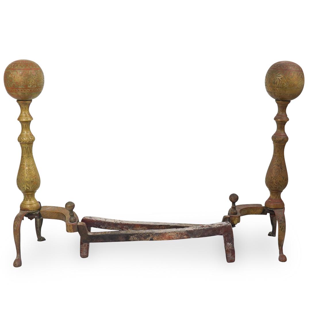 Pair of Oriental Brass Andirons: DESCRIPTION: A Pair of decorated brass andirons with ball finials. CIRCA: Early - Mid 20th Century ORIGIN: Oriental DIMENSIONS: H. 18.5" x W. 19" CONDITION: Good condition. See lot description for det