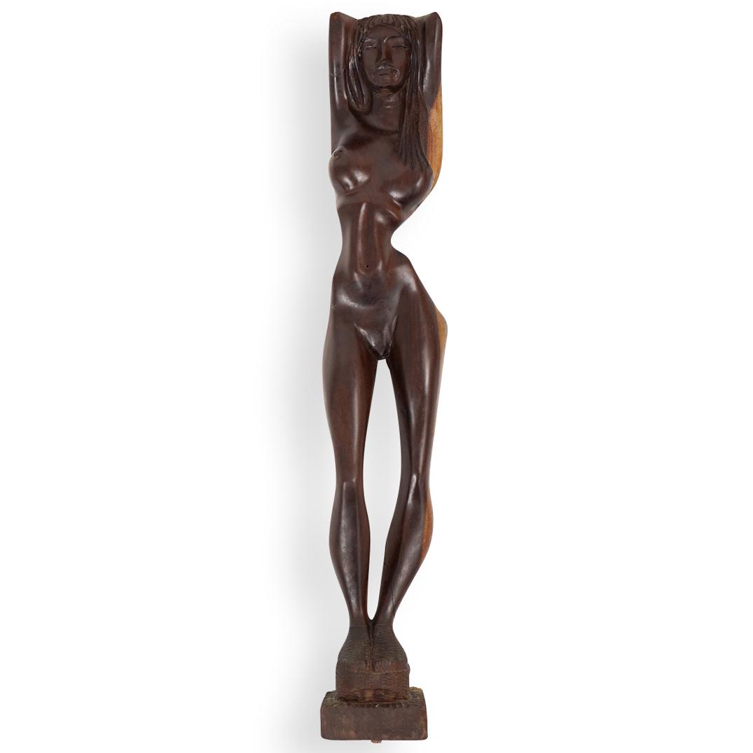 Raul La Montagne (Cuban, 20th Century) Wood Sculpture: DESCRIPTION: A carved wooden sculpture depicting a nude women, signed on the base "Raul la Montagne" CIRCA: 1980s ORIGIN: Cuba DIMENSIONS: H.19.75" x W.3.25" CONDITION: Good condition. See lot descrip