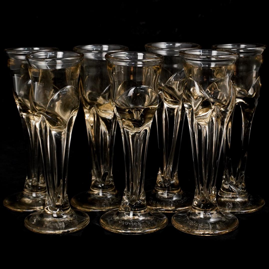 (7 pc) James Wayne Double Stem GobletsÃ‚: DESCRIPTION: James Wayne double stem goblet set of (7) Mild gold hue, hand blown in california, signed on bottom " James Wayne"Ã‚ Ã‚ CIRCA: 1970s ORIGIN: USA DIMENSIONS: H: 10" x Dm. 4"Ã‚ CON