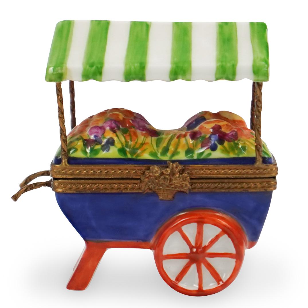 Limoges Porcelain Peint Main Rose Cart: DESCRIPTION: A porcelain rose cart pill box. Marked "Limoges, France, Peint Mein, ROCHARD"Ã‚ CIRCA: 20th Ct.Ã‚ ORIGIN: FranceÃ‚ DIMENSIONS: H:2.5" x L: 2.5" CONDITION: Great condition. See lo