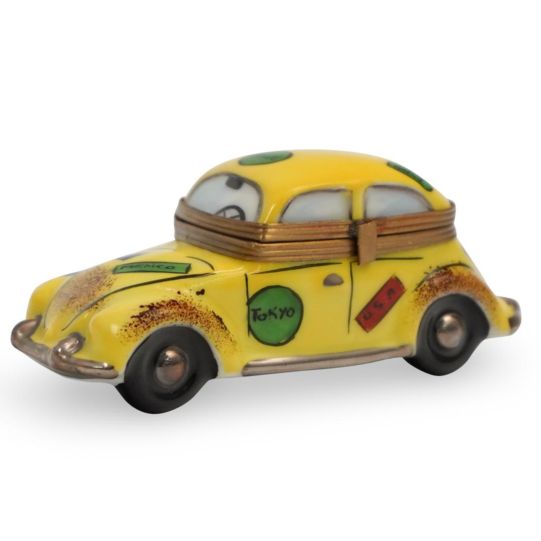 Limoges Taxi Cab Porcelain Pill Box: DESCRIPTION: A Limoges porcelain pill box. Features a taxi cab design with figures seen in the windows. Marked along the underside:"Limoges France Peint Main". CIRCA: Late 20th Ct. ORIGIN: France DIME