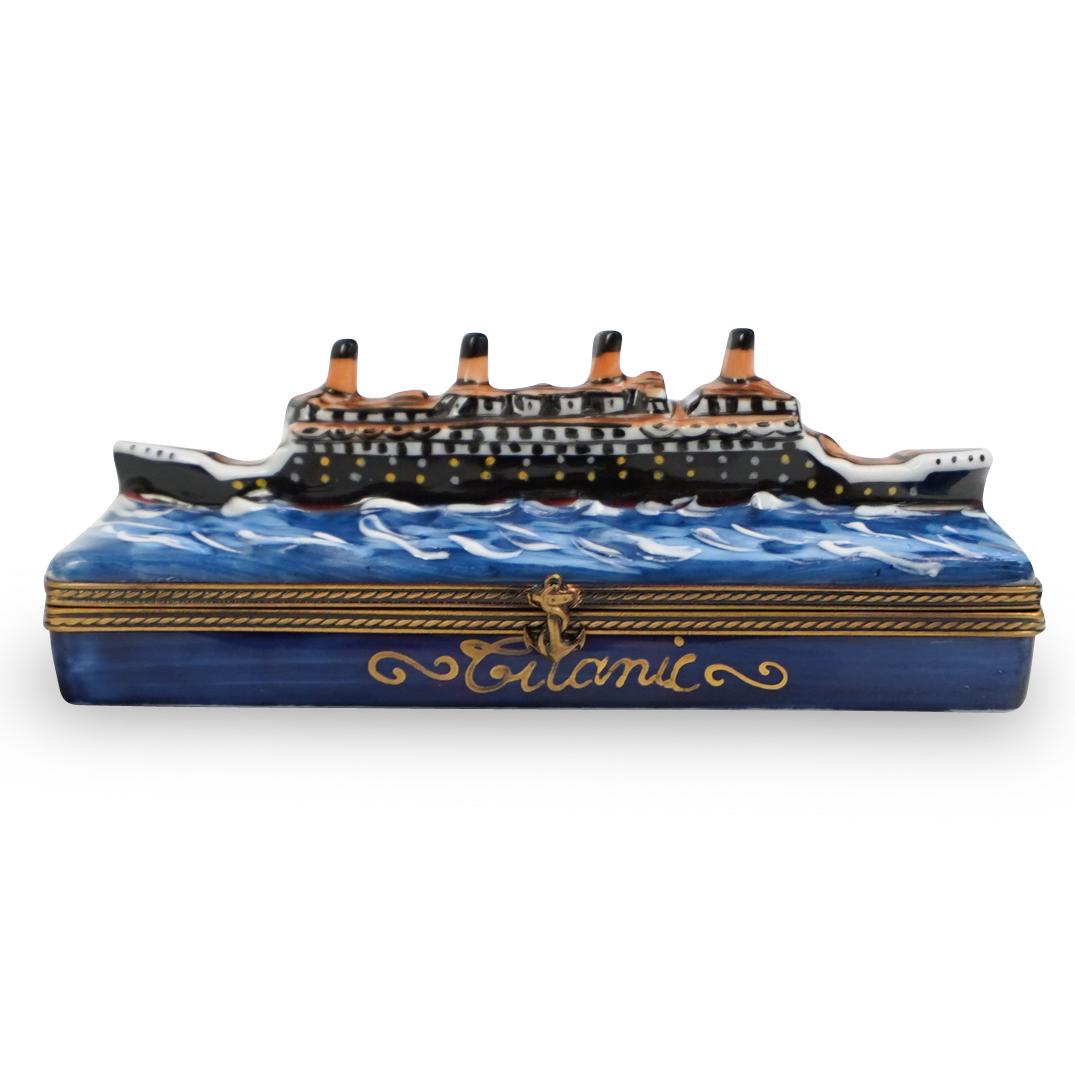 Limoges Porcelain Pill Box: DESCRIPTION: A Limoges porcelain pill box featuring the Titanic in waters hand painted. Finished with a gilt metal hardware lining the hinge. Marked inside " TITANIC LIVERPOOL" Marked along the unders