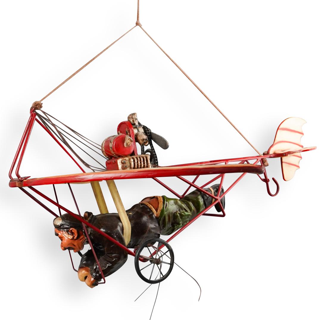 Vintage Hanging Decorative Hang Glider: DESCRIPTION: A Decorative vintage wood-painted hang glider, featuring a painted figure with painted metal propeller and frame. No apparent markings. CIRCA: 20th Century ORIGIN: Continental DIMENSIONS: