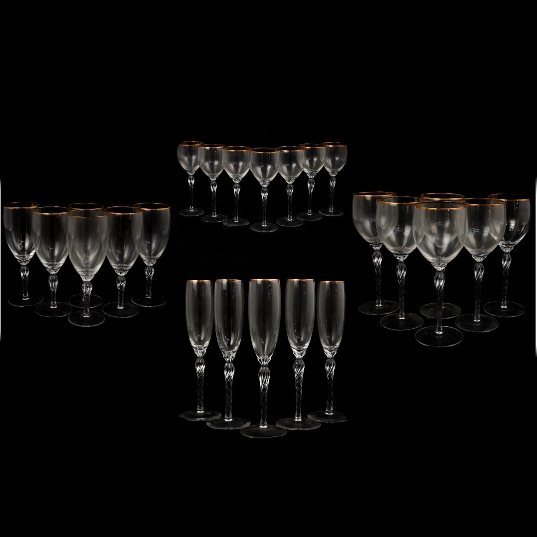 (24 Pc) Lenox "Monroe" Crystal Glasses: DESCRIPTION:(24 Pc) A Lennox USA "Monroe" set of gilded rim crystal glasses with twisted stem design, "Lenox USA" hallmarks on bottom of glasses. Included: (6 Pc) Red wine glasses H:8.5" x D:3" (7 Pc)