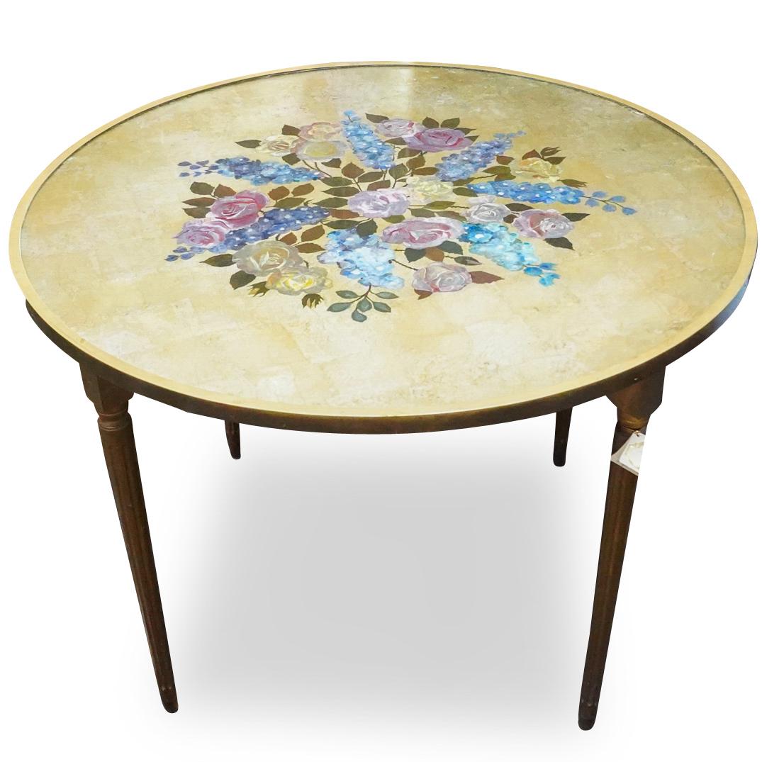 Italian Enamel and Giltwood Table: DESCRIPTION: An Italian circular table composed of a giltwood frame, decorated along the table top with enamel floral motifs, and completed with a glass table top. CIRCA: Early 20th Cent. ORIGIN: Ital