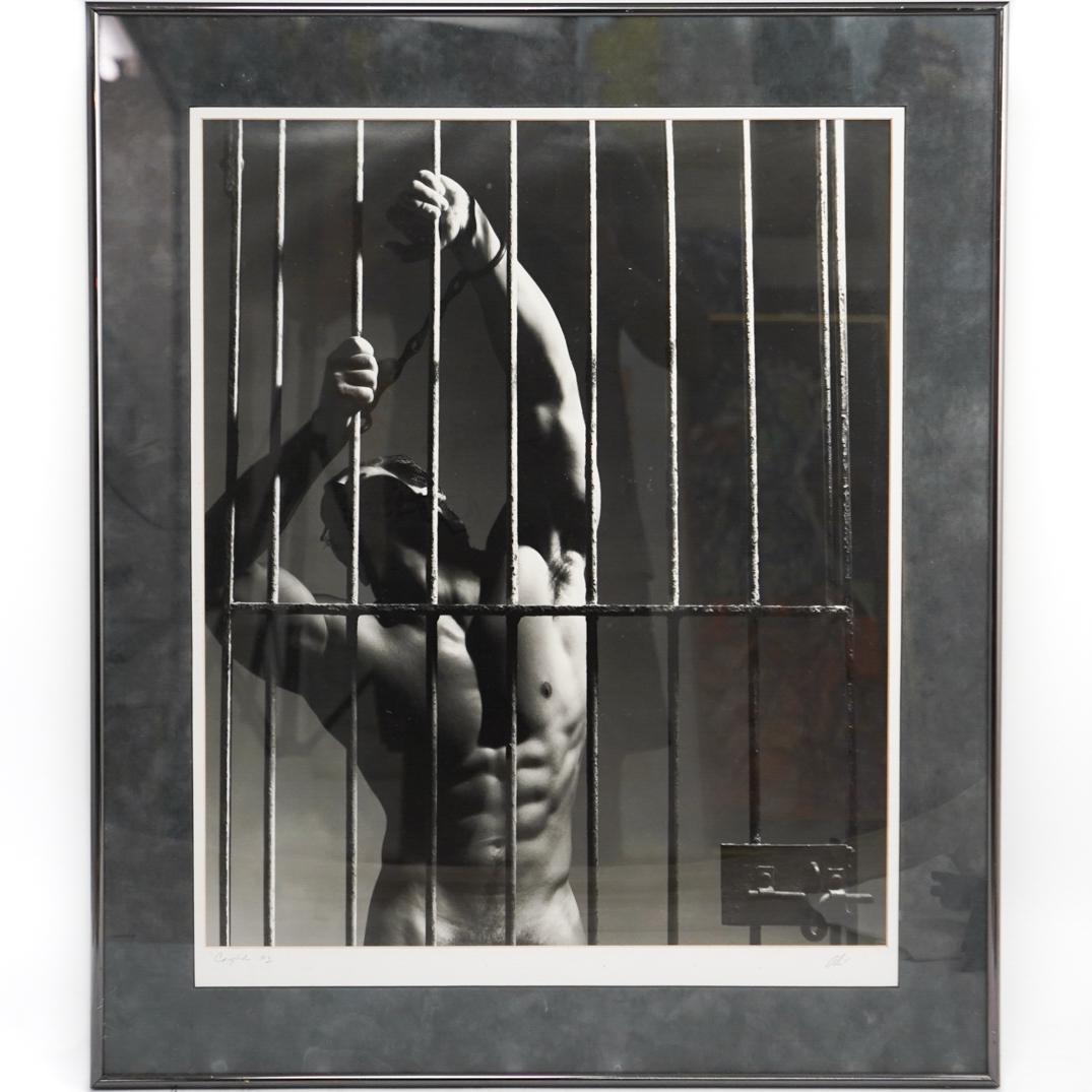 Ali Signed Erotic B&W Photograph: DESCRIPTION:A black and white erotic male photograph signed "Ali" at bottom right. Completed in a silver toned metal frame. CIRCA:20th Ct. ORIGIN:USA DIMENSIONS:L:30" x W:25" CONDITION: Great conditio