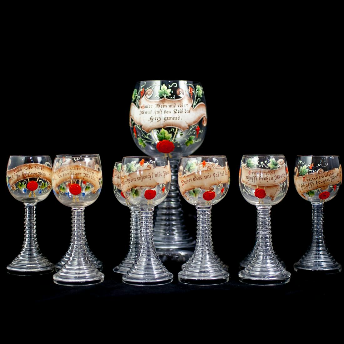 (11 Pc) Painted German Wine Glasses: DESCRIPTION: Hand-Painted Blown German Wine Glasses with Goblet. Painted scroll and leaves with German phrases.Ã‚ CIRCA: Early- Mid20th Century ORIGIN: German DIMENSIONS: Goblet: H. 11.5" x W. 4" /