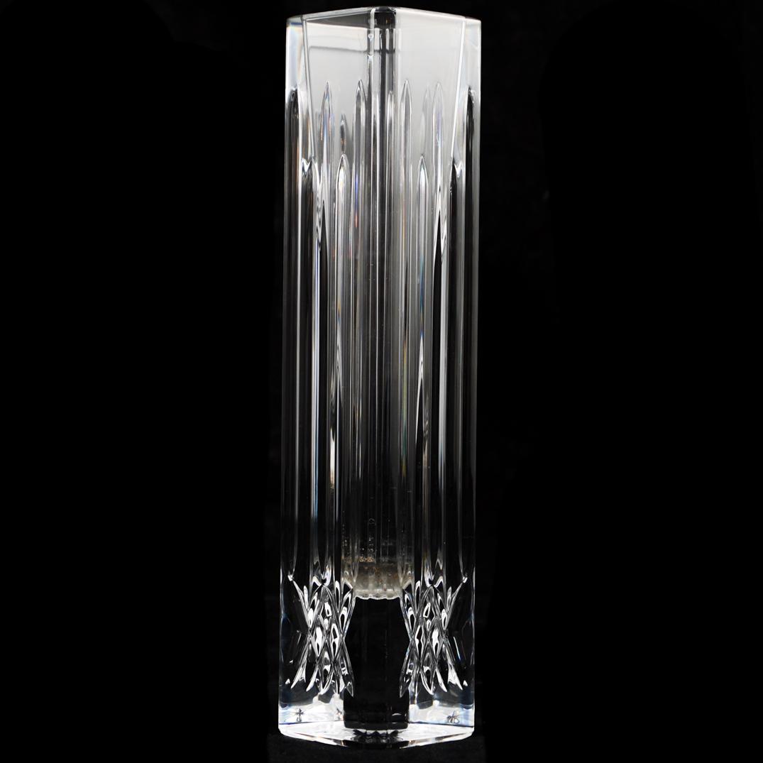 Waterford Crystal Bud Vase: DESCRIPTION: A Waterford crystal bud vase decorated with vertical incision lines, and marked along the underside "Waterford". CIRCA: 21st Cent. ORIGIN: Ireland DIMENSIONS: H: 11" W: 3" CONDITION: Grea